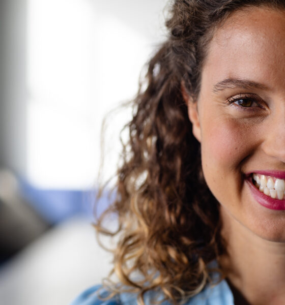 Half portrait of happy caucasian casual businesswoman in office. Casual office, business, professional and work, unaltered.